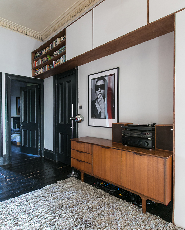 High Victorian ceilings in an apartment are used to create a bookshelf and cupboard – James Balston