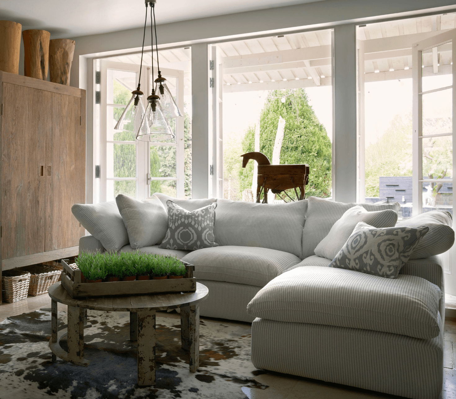 The Truman sofa by Andrew Martin is the perfect canvas for characterful pieces
