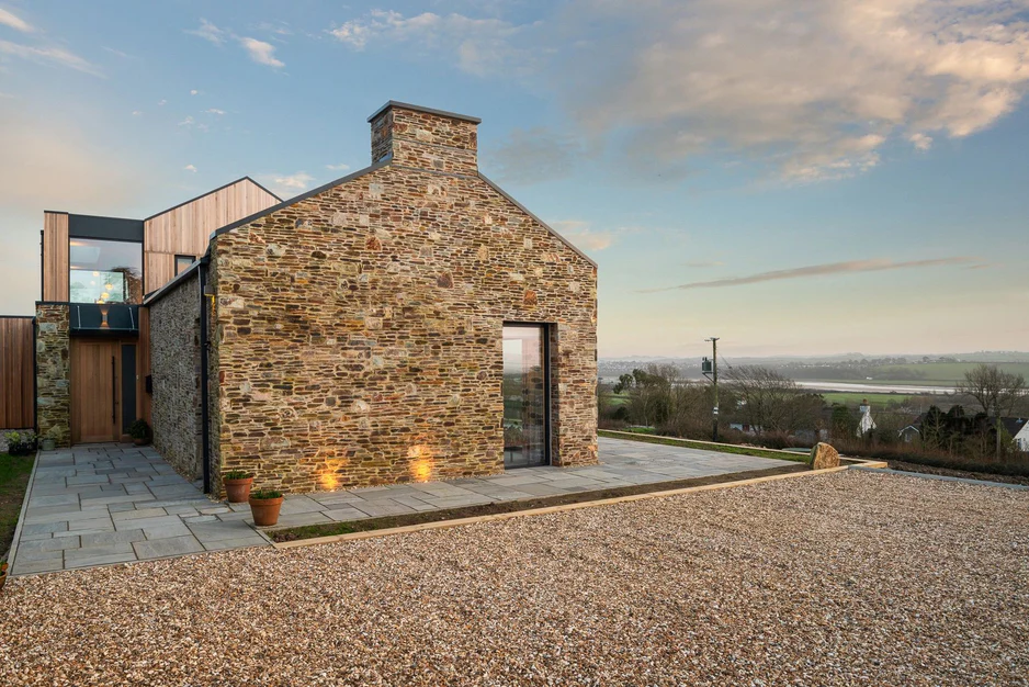 Natural stone cladding adds depth to a modern renovation